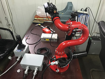 Red electric ss water cannon set up on a table