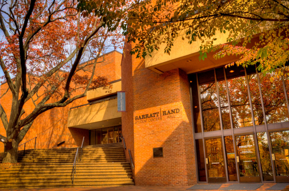 Rand Hall and Sarratt Student Center staircase with autumn leaves
