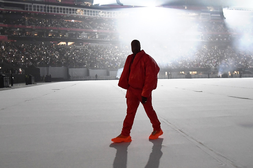 Kanye West standing in front of crowd