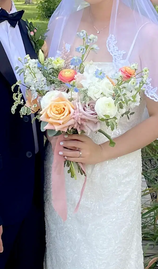 Bride posing with her bouquet.