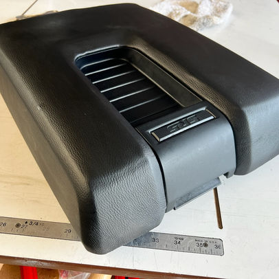 center car console covered in black leather.