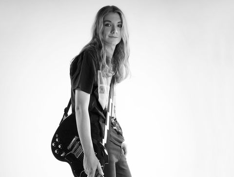 musician artist with guitar photographed in jeans and t-shirt by alise black studios