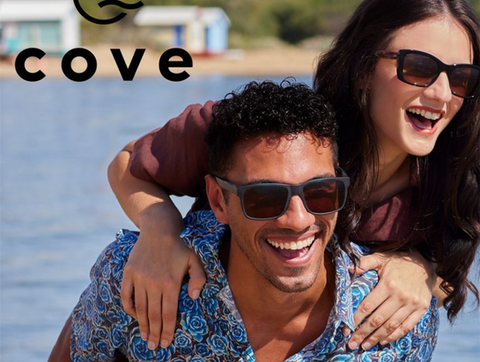 Fashion photoshoot of Cove Eyewear with couple on the beach laughing photographed by Alise Black Studios.