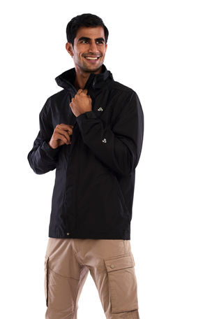 male model wearing back jacket with tan pants standing on white ecommerce backdrop at Alise Black Studios