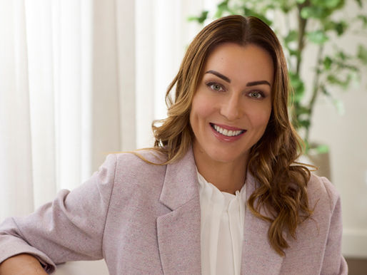woman smiling with a white top and pink jacket in natural light photographed by Alise Black Studios