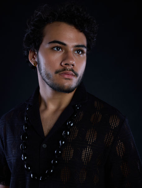 male model with facial hair black shirt and photographed in studio lighting at Alise Black Studios