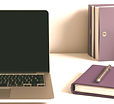 laptop closed on a desk with a purple fo