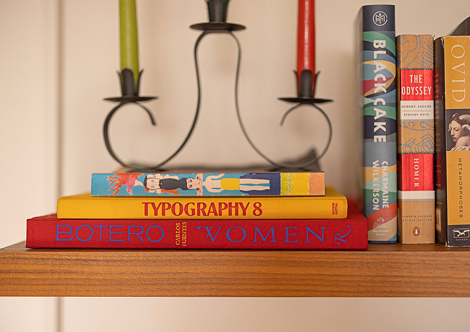 books and candles on a shelf