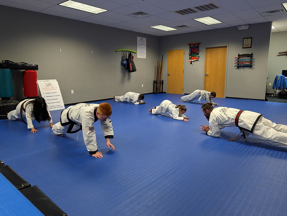 martial arts student holding plank to build core strength