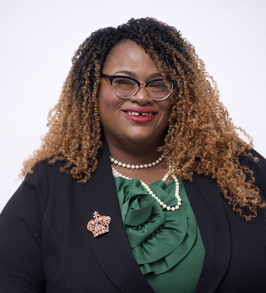 ID_Gretchen Sipp Head Shot_Gretching is an African American woman with obre curls, wearing