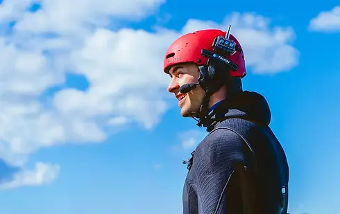 Student wearing red mystic helmet with BBTalkin radio communication system and O’Neill wet