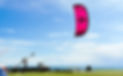 Kiteboarding and wingfoiling lessons with DKP, pink North kite flying at Clover Point Vict