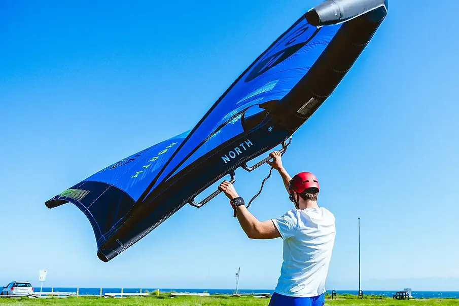Student flying blue wing at Clover point during DKP Wingfoiling Lesson.webp