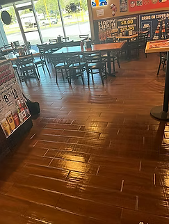 Tile floor before professional cleaning at Kickin Wingz restaurant in Hudson Florida.