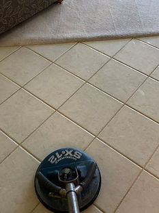 Tile and grout cleaning in a Trinity FL home kitchen restoring the appearance of the grout lines.