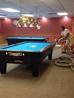 Carpet being professionally cleaned in the recreation room of a Hudson FL community center by Suds Up Carpet Cleaning.
