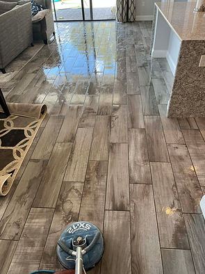 Tile and grout cleaning being performed in the living room of an Odessa Florida home.