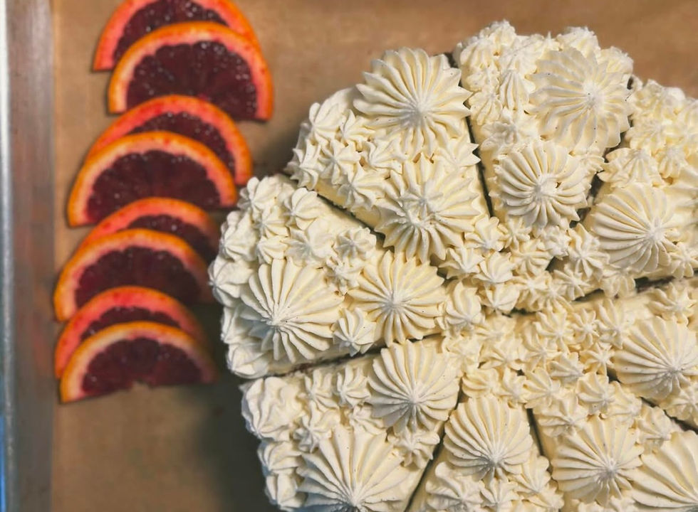 Carrot cake with clementine cream cheese frosting and raspberry oranges