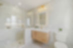 Modern bathroom remodel with glass shower and floating vanity