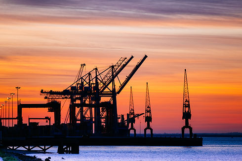 beautiful-silhouette-port-machinery-during-sunset-min.jpg