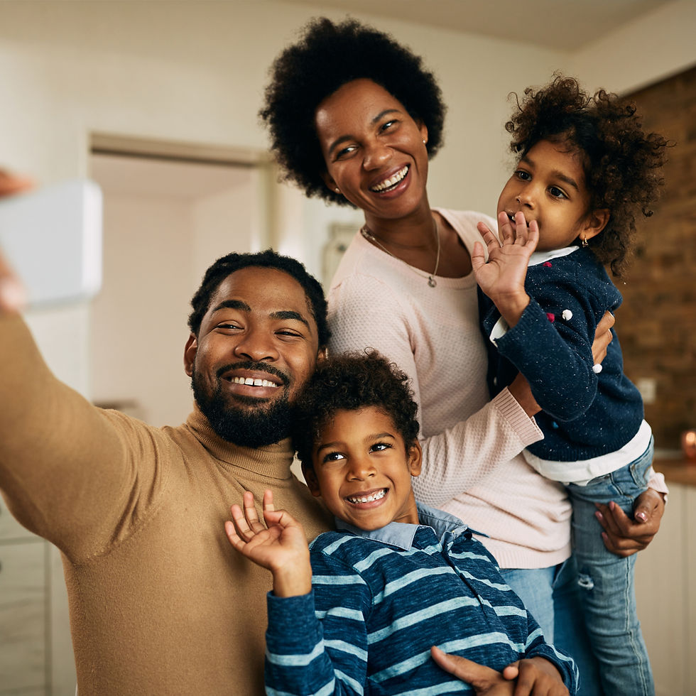 happy-black-parents-with-kids-making-video-call-smart-phone-home_edited.jpg