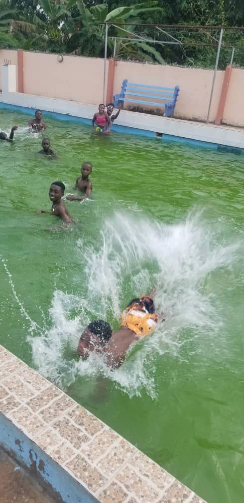 Sankofa children in pool, Ghana