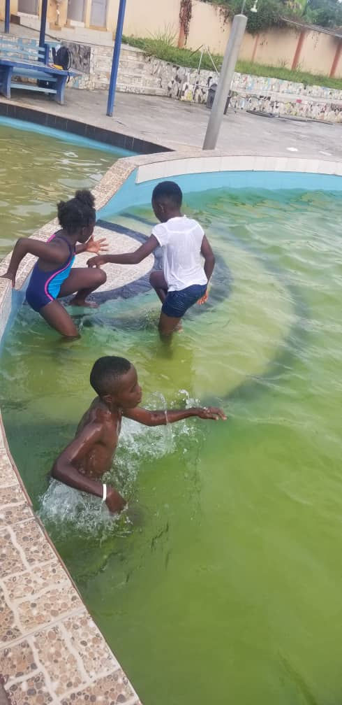 Sankofa children in pool, Ghana