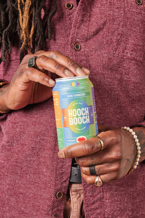 Person opening Hooch Booch can