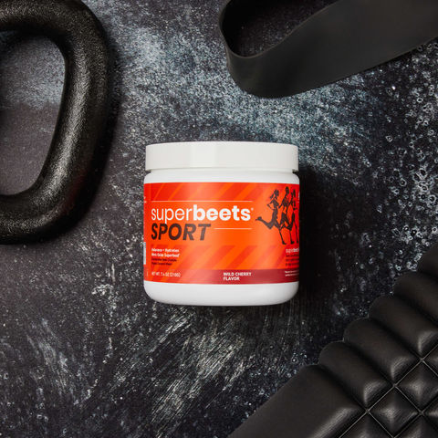Styled gym product photography of workout gear with a SuperBeets can for advertising campaign