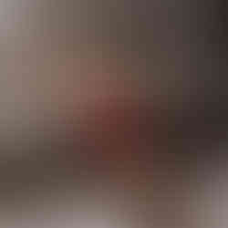 woman on floor in red bodysuit pulling her straps off