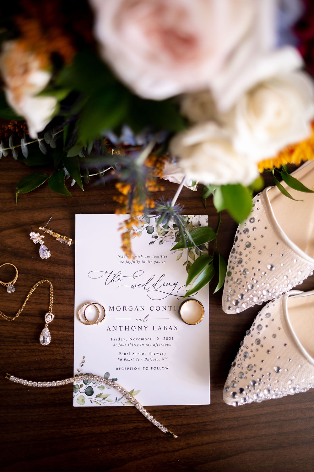 wedding details invitation jewelry brides shoes rings bouquet