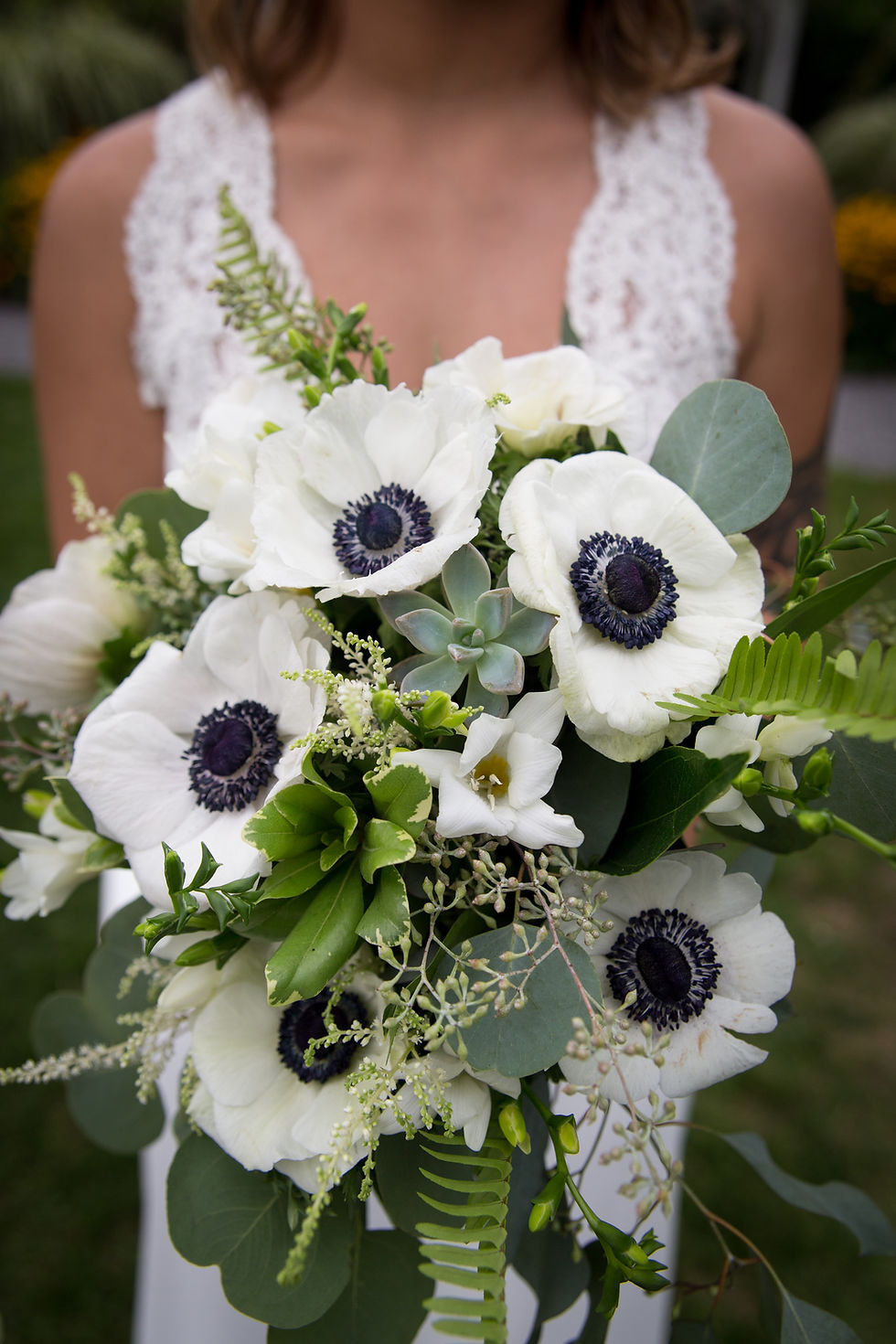 North Park Florist bridal bouquet held by bride at Buffalo Botanical Garden
