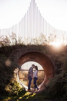couple stands inside a circular sculpture at silo city