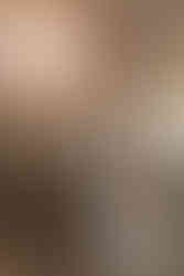 bride and groom stand face to face in art deco city hall