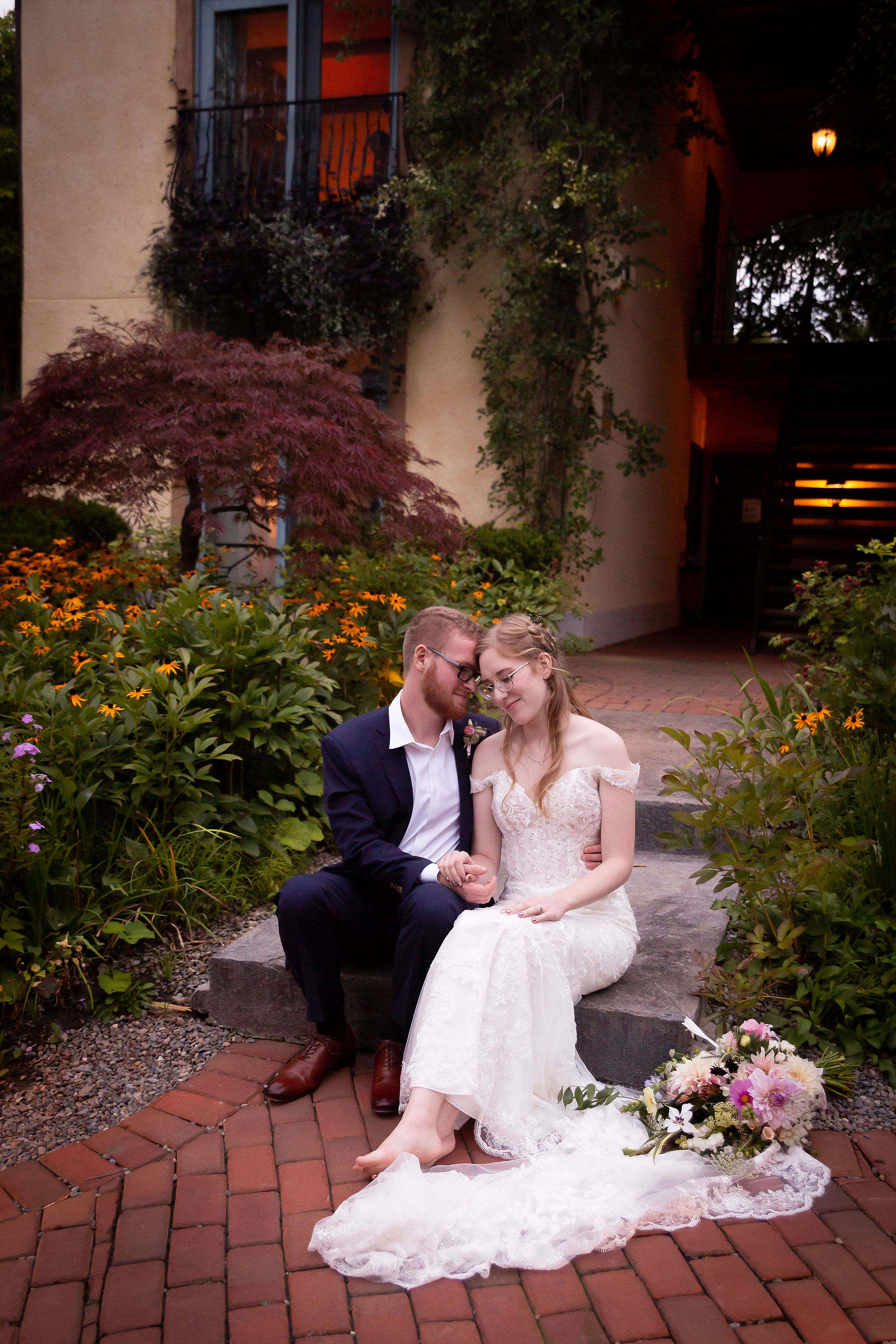 bride and groom photo in gardens at Mirbeau Inn and spa finger lakes wedding venue