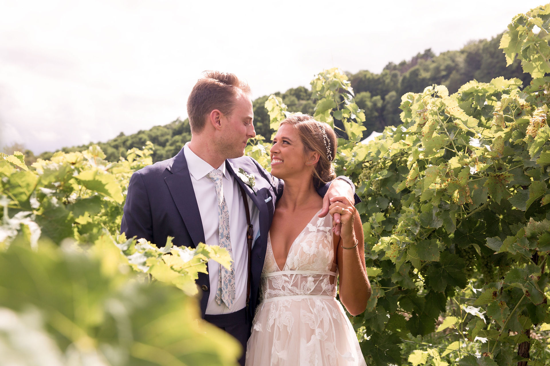 bride and groom in vineyard at heron hill winery finger lakes wedding venue