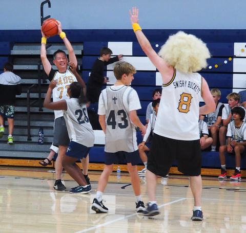 Grads play off against Dads in silly costumes at our annual Dads vs. Grads tournament.