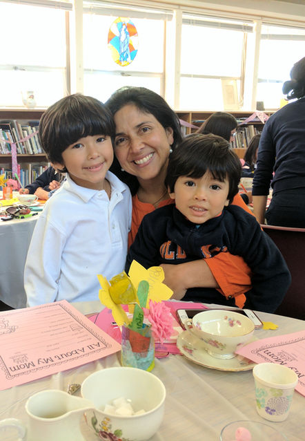 A mom with her sons at a St. Nicholas School Mother/Son event.