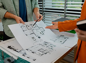 An architect and engineer work as a team, an engineer is discussing with coworker about de