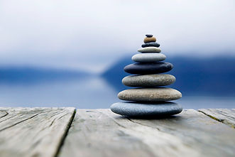 zen-balancing-pebbles-misty-lake.jpg