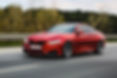 red-luxury-sedan-road.jpg