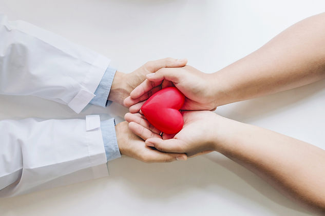 doctor-patient-holding-red-heart-together.jpg