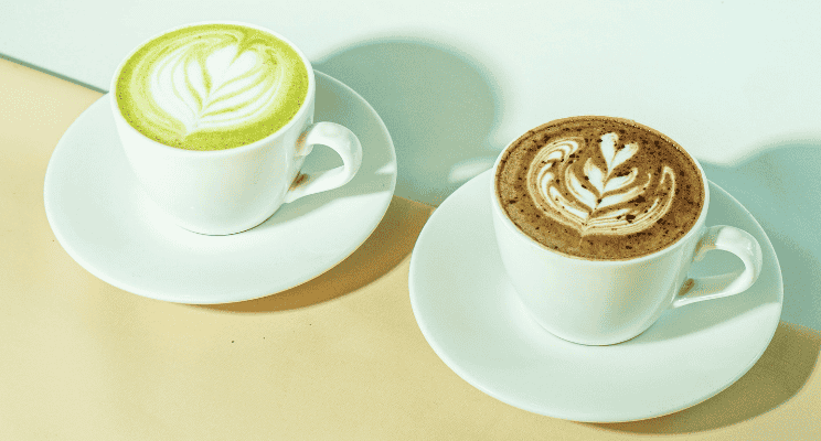 a couple of cups with matcha and coffee