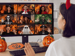 a woman in front of the laptop during a virtual halloween event