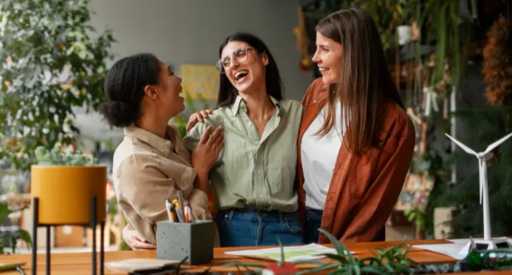 Women happy in office with plants