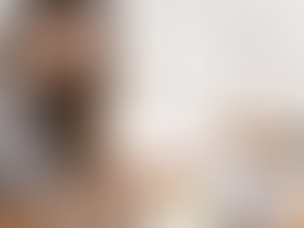 woman looking down at her notes while holding her pen