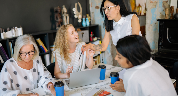 colleagues discussing in person at the workplace