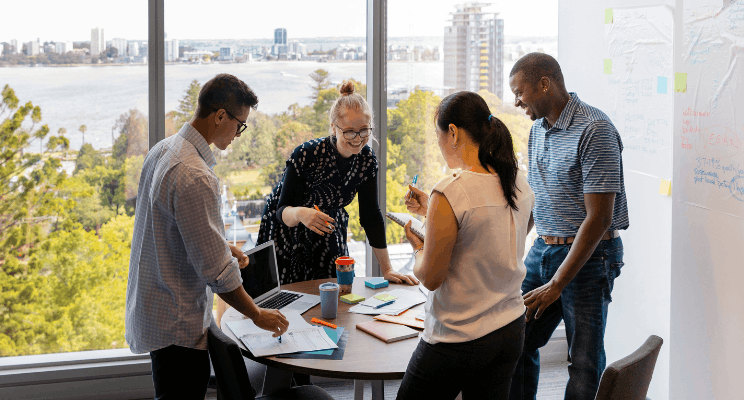 a group of colleagues working together in person