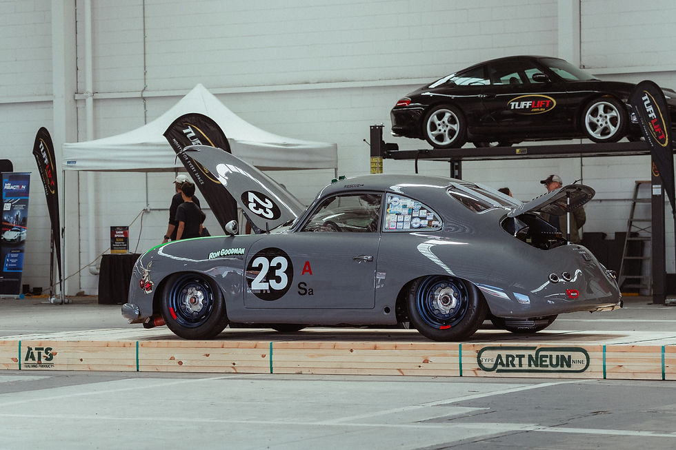 A vintage Porsche race car, number 23, on display at the Artneun “Porsche as Art” exhibition in Melbourne. Its timeless design and racing heritage embody the spirit of precision engineering celebrated throughout the event photographed by Velours Media.