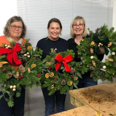 Friends enjoying wreath making class in Bedford